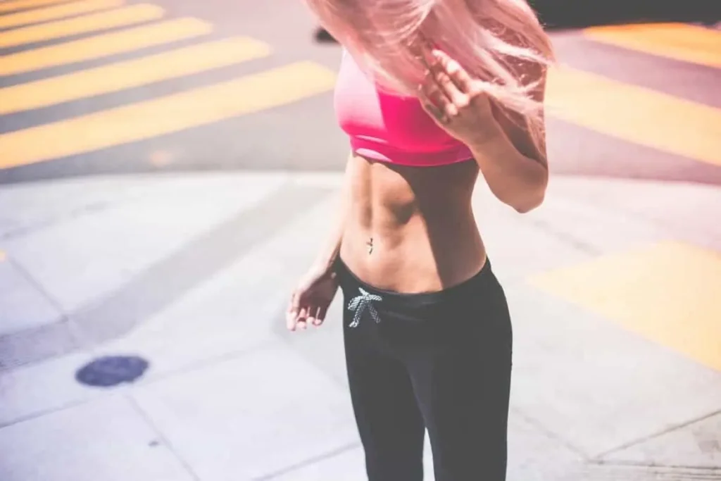Woman with toned stomach after LA-EMS Body Sculpting Treatment Acocks Green